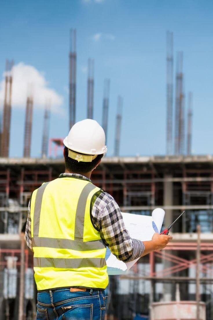 Architectural blueprint and construction site